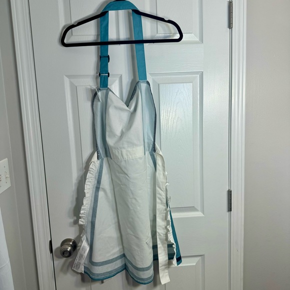 NWT. Disney Apron Alice In Wonderland UK Pavilion “It's Always Tea Time” Apron - Picture 9 of 11